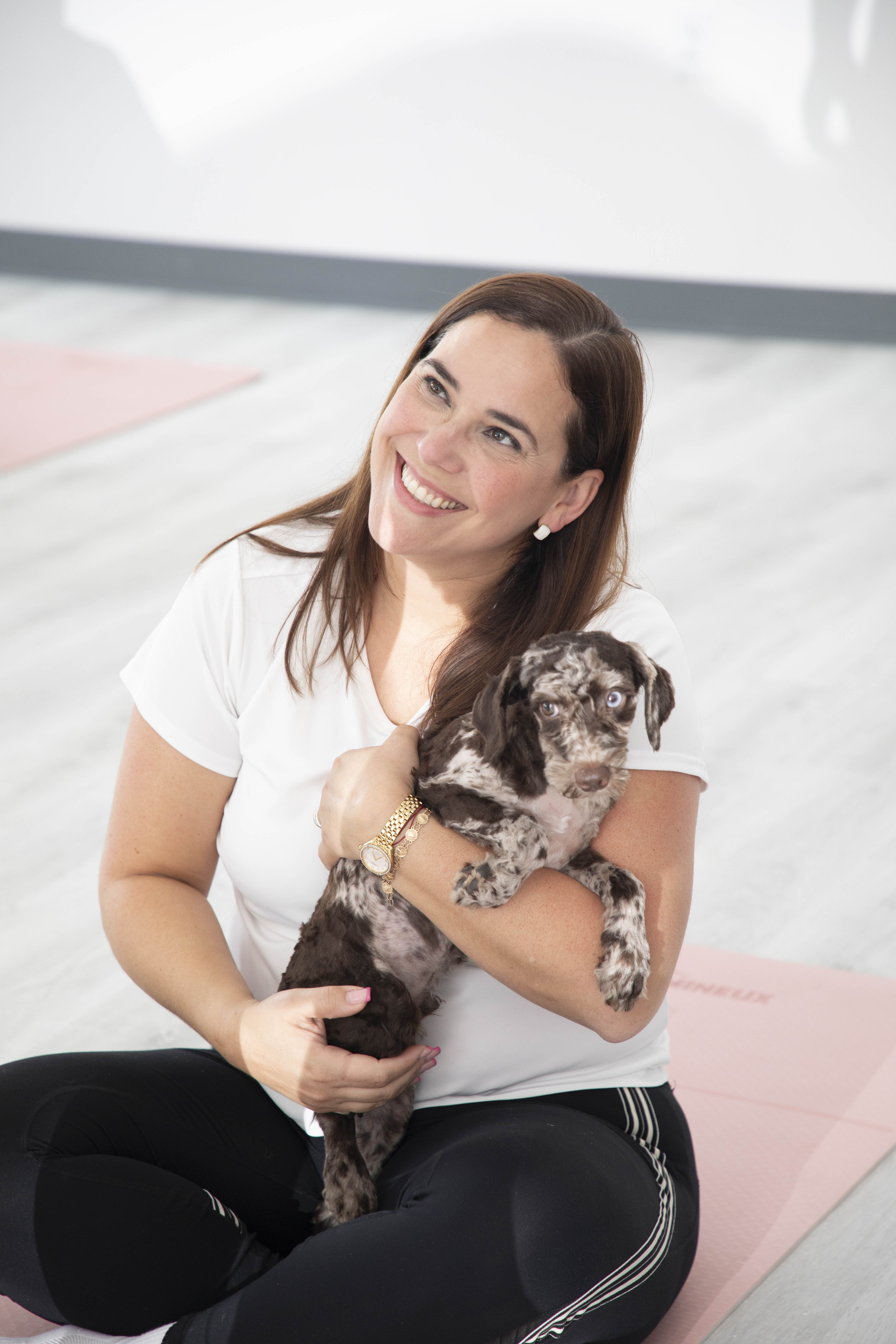 Instructor with a merle puppy in the studio